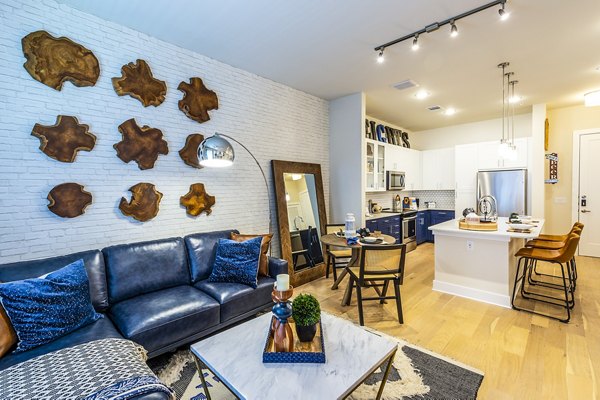 Cozy living room featuring modern decor and ample seating at Foundry on 19th Apartments