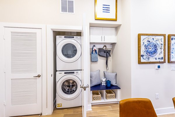Modern laundry room with high-efficiency machines at Foundry on 19th Apartments, a Greystar luxury property in a vibrant urban location
