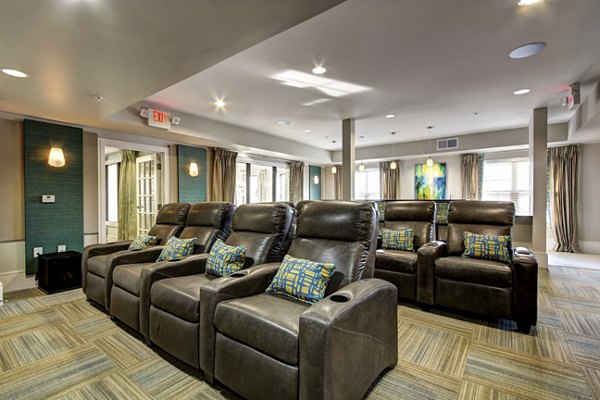 Theater with plush seating at The Manor at Weston Apartments