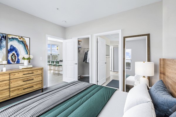 Cozy bedroom with modern decor at Pike3400 Apartments