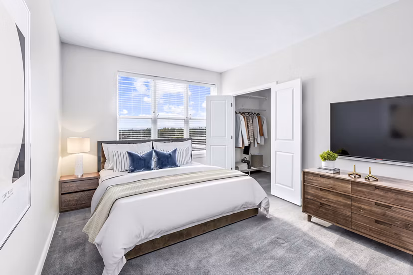 Bedroom featuring modern decor and plush bedding at Pike3400 Apartments in downtown Baltimore