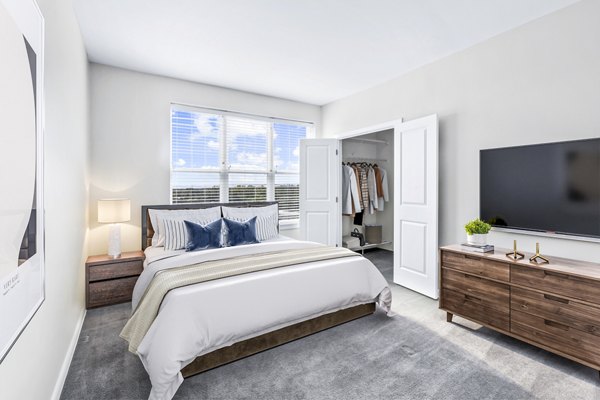 Bedroom featuring modern decor and plush bedding at Pike3400 Apartments in downtown Baltimore