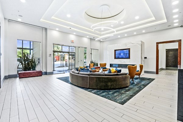 Spacious clubhouse/lobby with modern seating and decor at Pike3400 Apartments, offering a welcoming community atmosphere