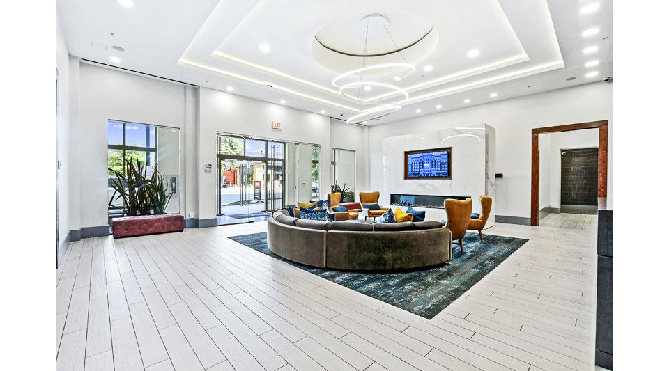 Spacious clubhouse/lobby with modern seating and decor at Pike3400 Apartments, offering a welcoming community atmosphere