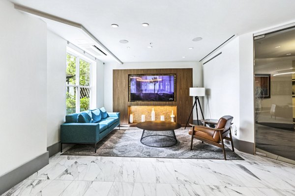 Clubhouse lobby featuring modern furnishings and elegant dÃ©cor at Pike3400 Apartments in luxury setting