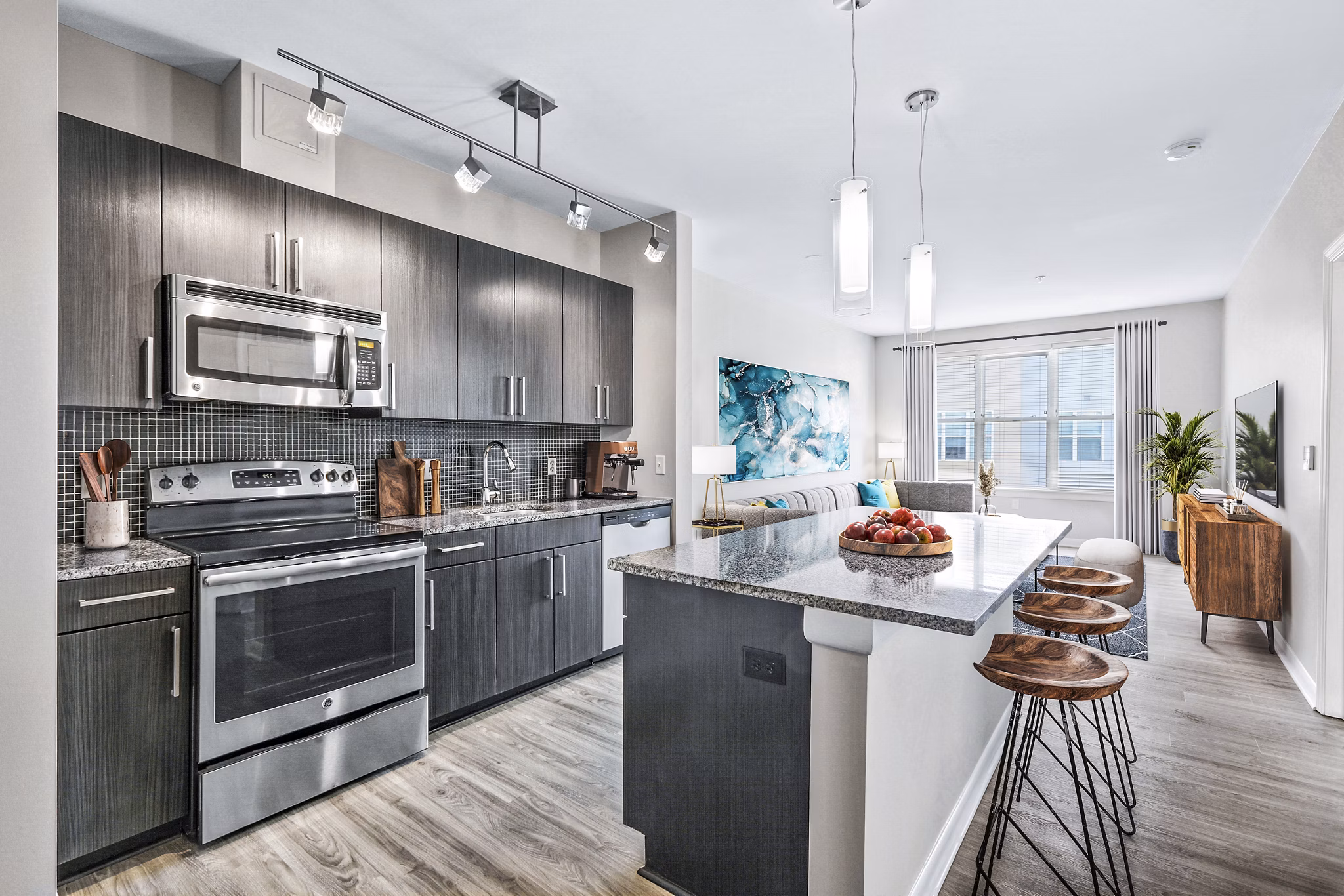 Modern kitchen featuring sleek countertops and stainless appliances at Pike3400 Apartments