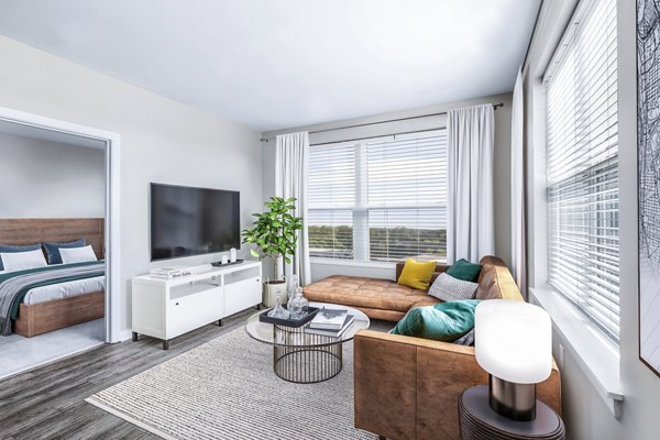 Spacious living room with modern decor at Pike3400 Apartments