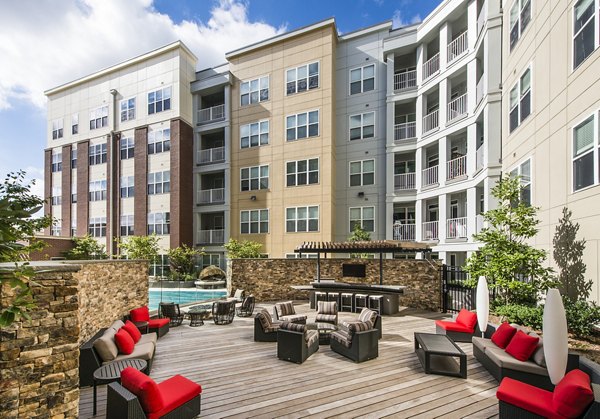 Outdoor BBQ area with modern grills at Pike3400 Apartments, ideal for entertaining and social gatherings