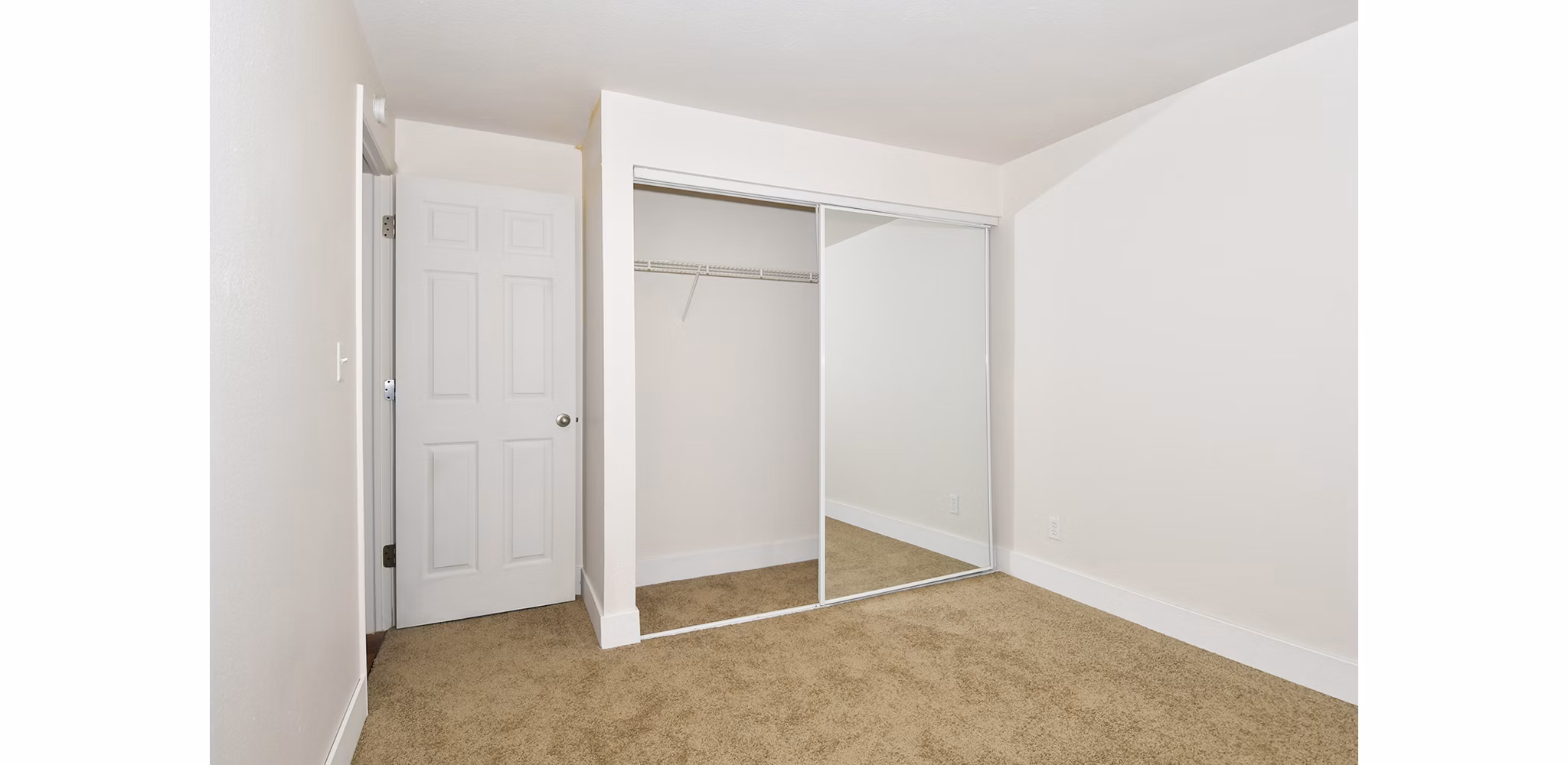 Elegant bedroom with modern furnishings at Lake Crest Apartments