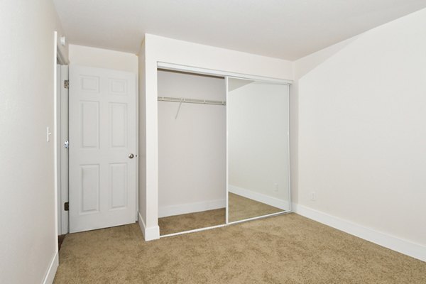 Elegant bedroom with modern furnishings at Lake Crest Apartments