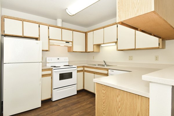 Modern kitchen with stainless steel appliances at Lake Crest Apartments