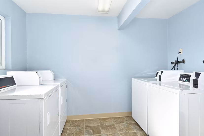 Modern laundry facility with energy-efficient machines at Lake Crest Apartments, ideal for convenient living
