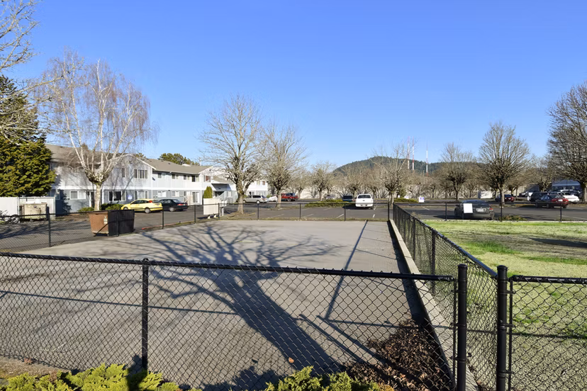 Pet-friendly dog park with agility equipment at Lake Crest Apartments, offering a fun and secure space for residents' pets to play