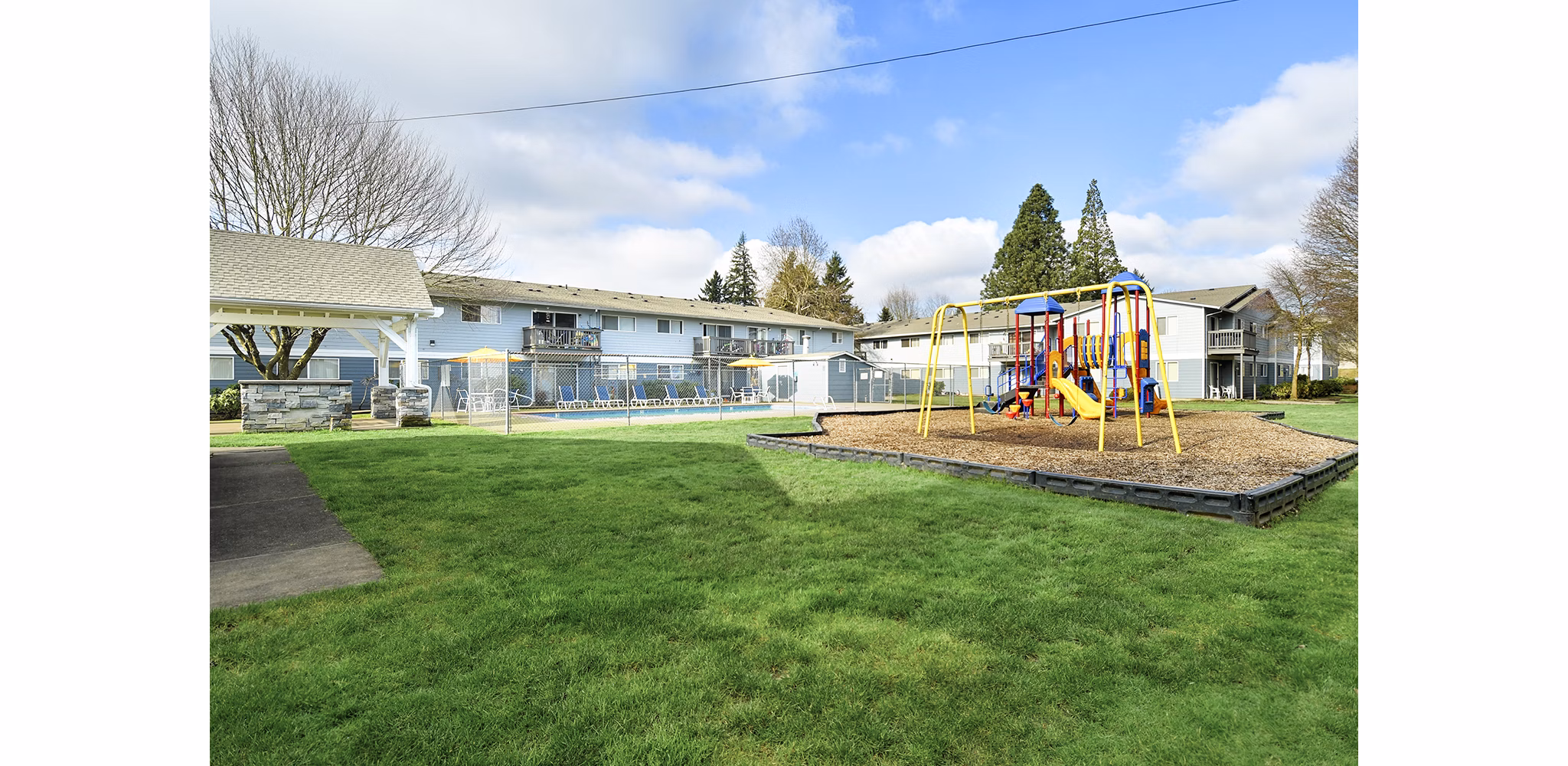 Modern playground with colorful equipment at Lake Crest Apartments