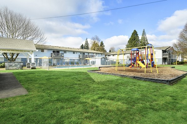 Modern playground with colorful equipment at Lake Crest Apartments