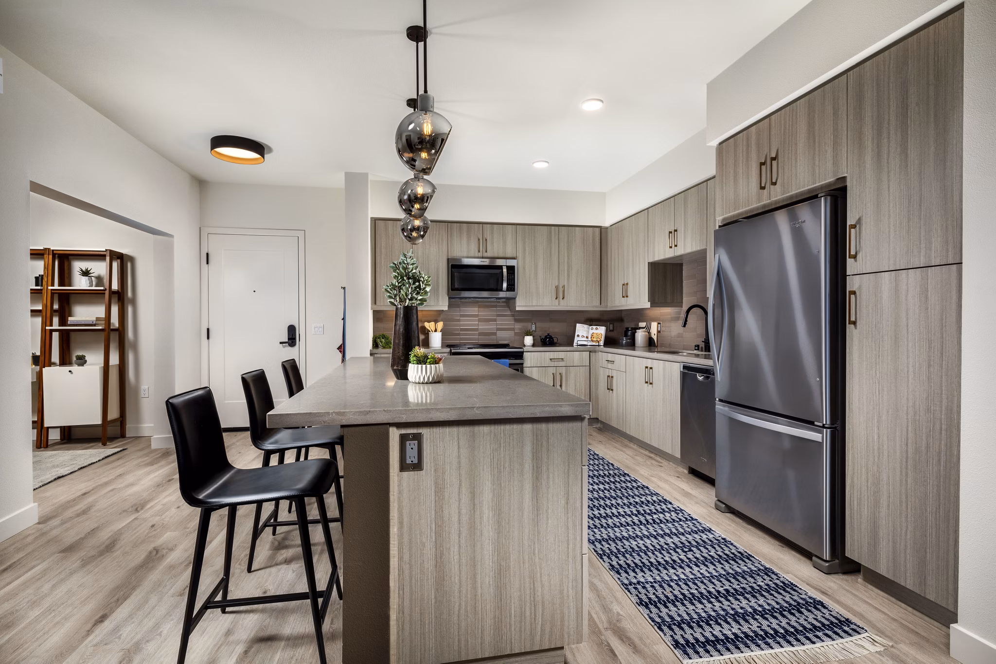 Modern kitchen with sleek cabinetry and stainless-steel appliances at Cameo Apartments