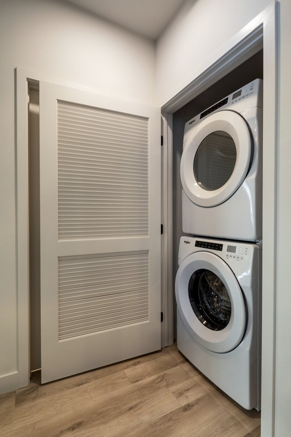 Laundry room with modern appliances at Cameo Apartments, Greystar luxury apartments in Los Angeles