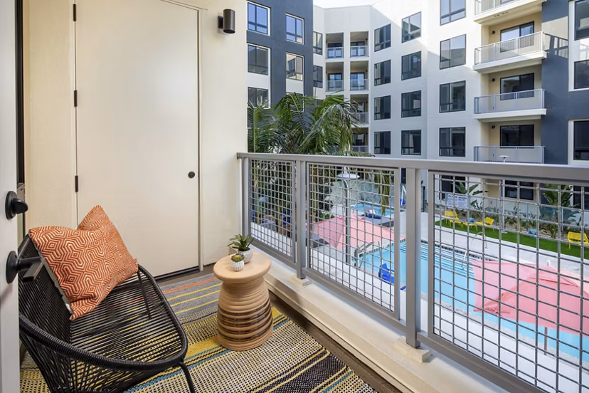 Patio with outdoor seating and garden view at Cameo Apartments, luxury living by Greystar