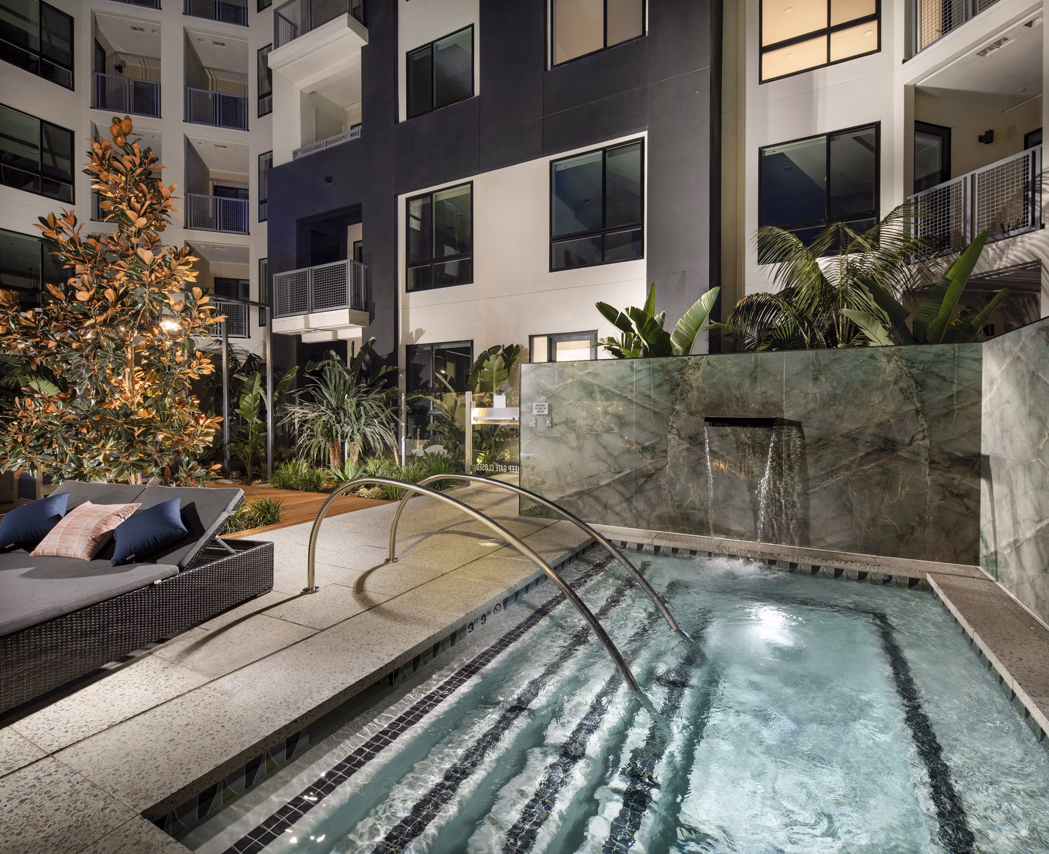 Rooftop swimming pool at Cameo Apartments with city skyline views