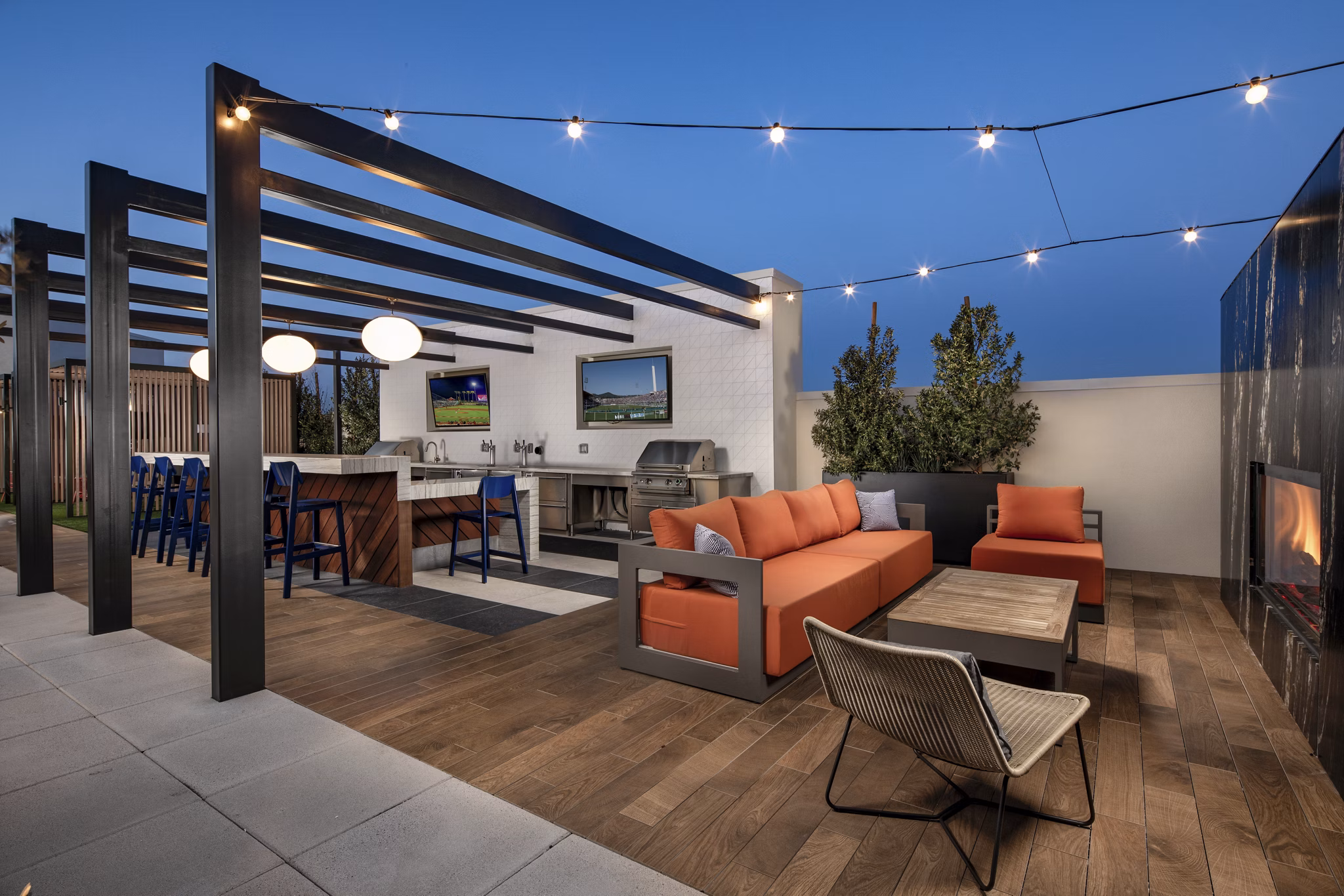 Scenic rooftop deck with lounge seating at Cameo Apartments providing panoramic views of Seattle skyline