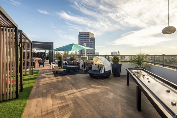 Scenic rooftop deck with cozy seating areas at Cameo Apartments