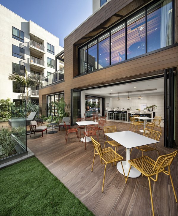 Patio with comfortable seating and fire pit at Cameo Apartments