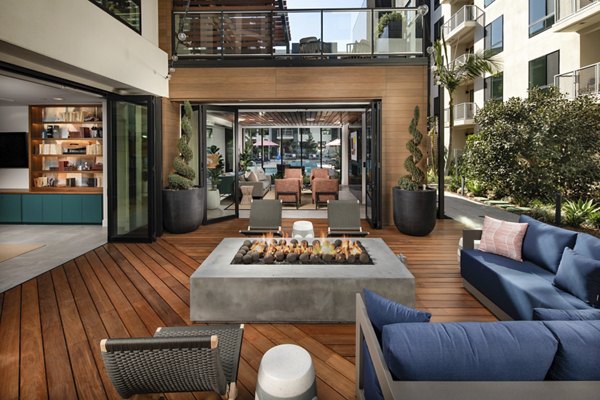 Fire pit lounge area at Cameo Apartments offering cozy outdoor seating for relaxing evenings