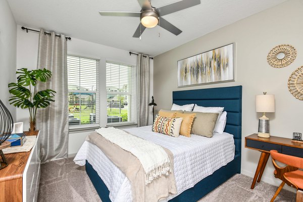 Spacious bedroom with modern furnishings at Isla Apartments, offering luxury living in Greystar's vibrant urban community