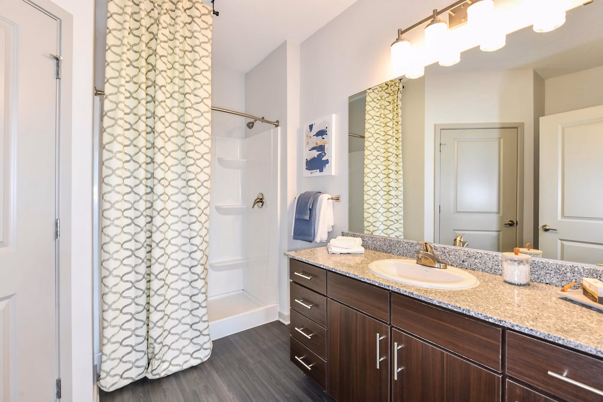 Bathroom featuring sleek fixtures and modern design at Isla Apartments, a luxury property