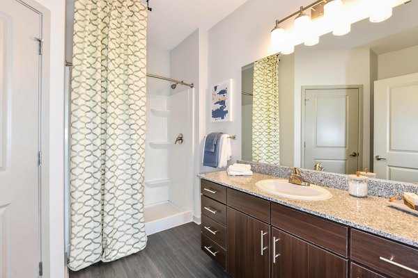Bathroom featuring sleek fixtures and modern design at Isla Apartments, a luxury property