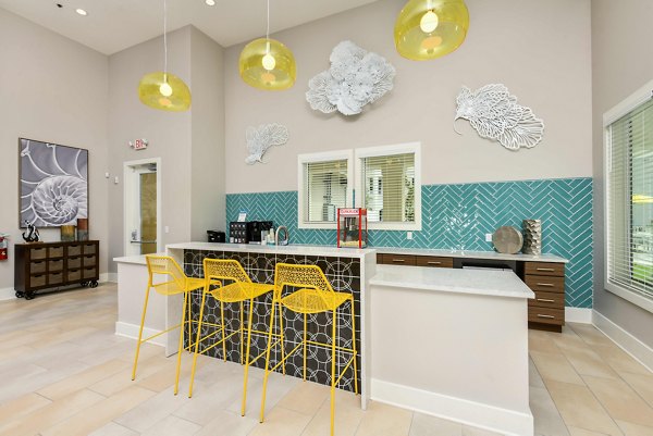 Clubhouse featuring modern design and open seating at Isla Apartments, a Greystar luxury community