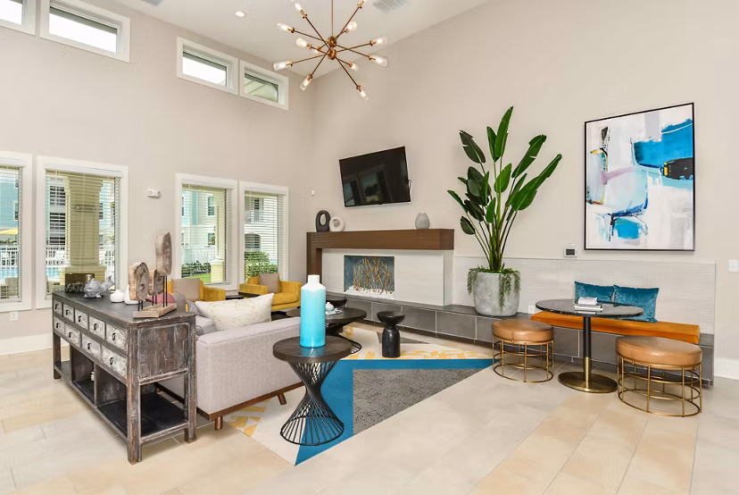 Modern clubhouse featuring stylish seating and gaming areas at Isla Apartments in Greystar community