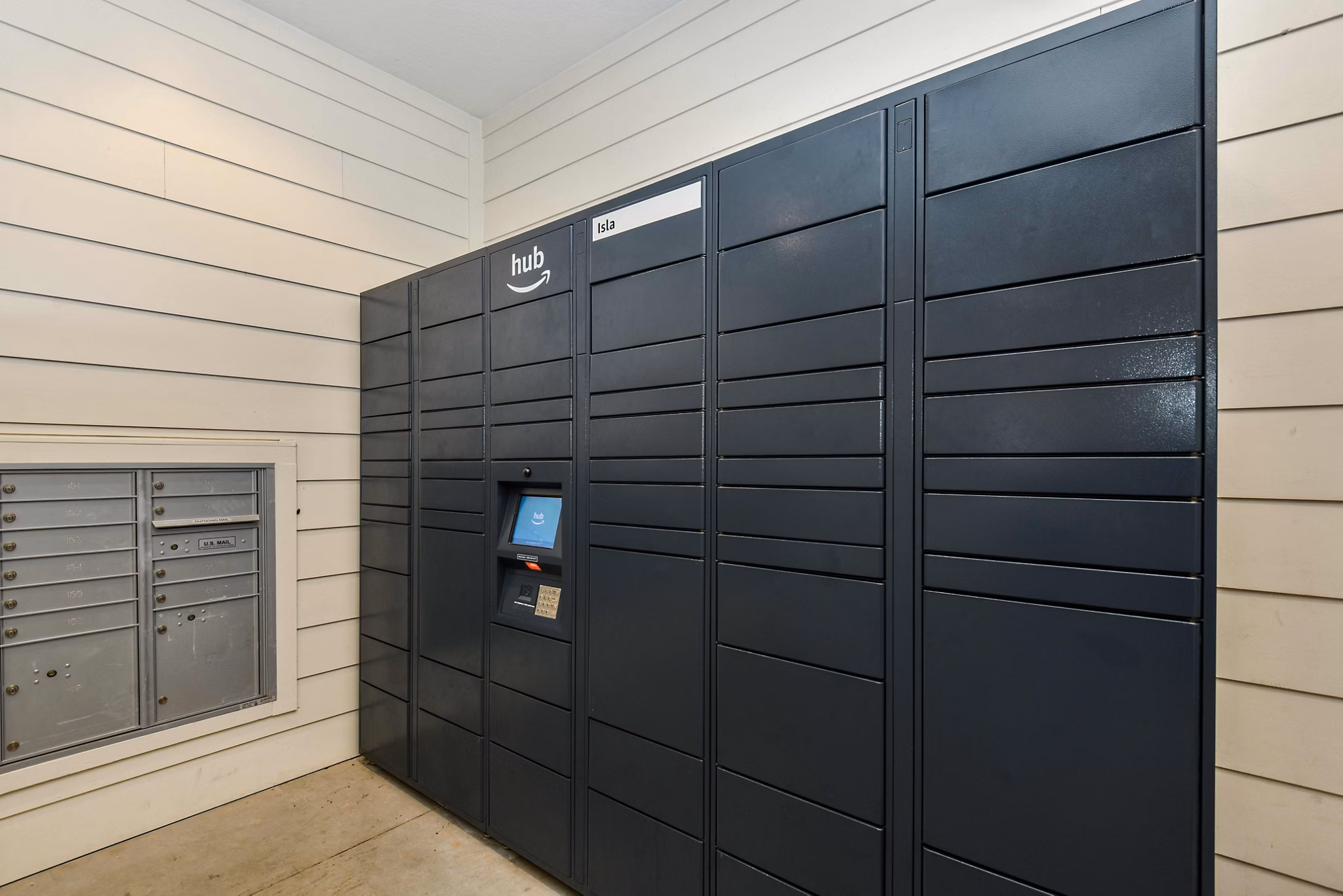 Convenient parcel locker at Isla Apartments for safe package delivery and easy resident access