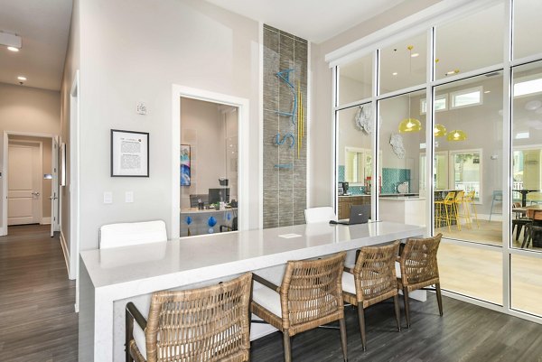 Clubhouse featuring modern design and seating areas at Isla Apartments