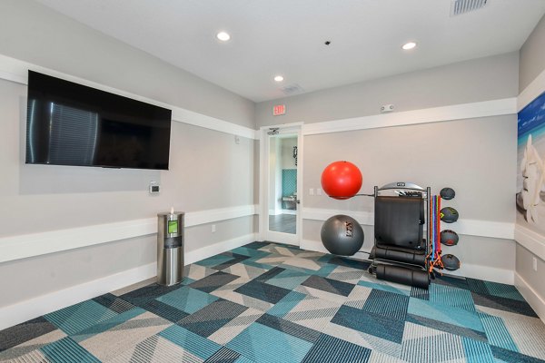Modern fitness center with state-of-the-art equipment at Isla Apartments