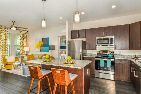 Spacious kitchen with modern appliances at Isla Apartments