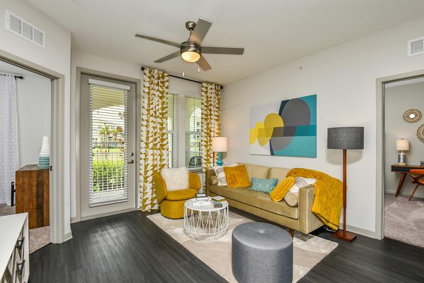 Spacious living room with modern furnishings at Isla Apartments, luxury residence