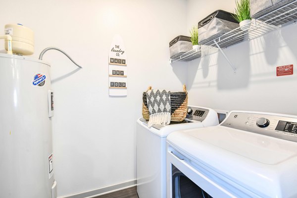 Laundry room with eco-friendly washers and dryers at Isla Apartments