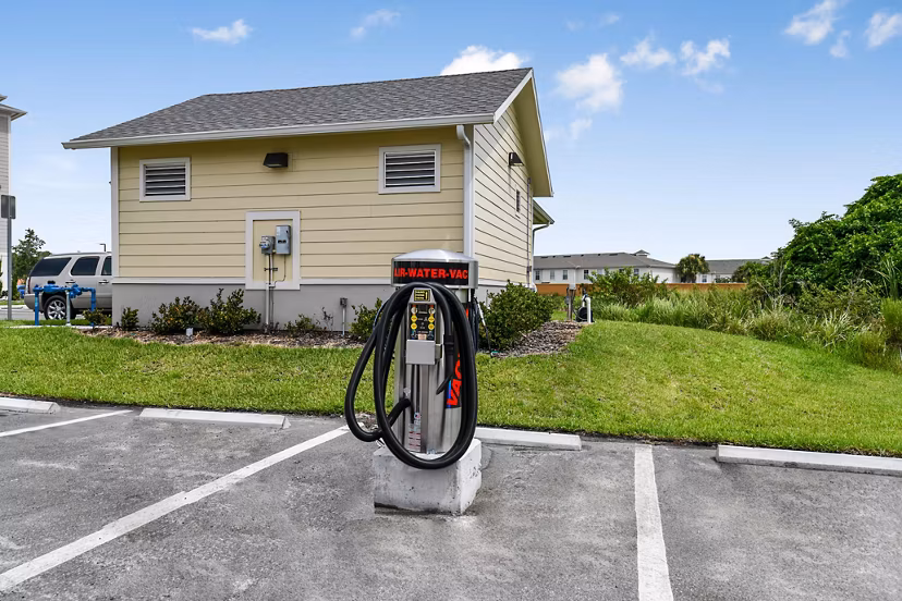 Car care station at Isla Apartments with convenient amenities for residents