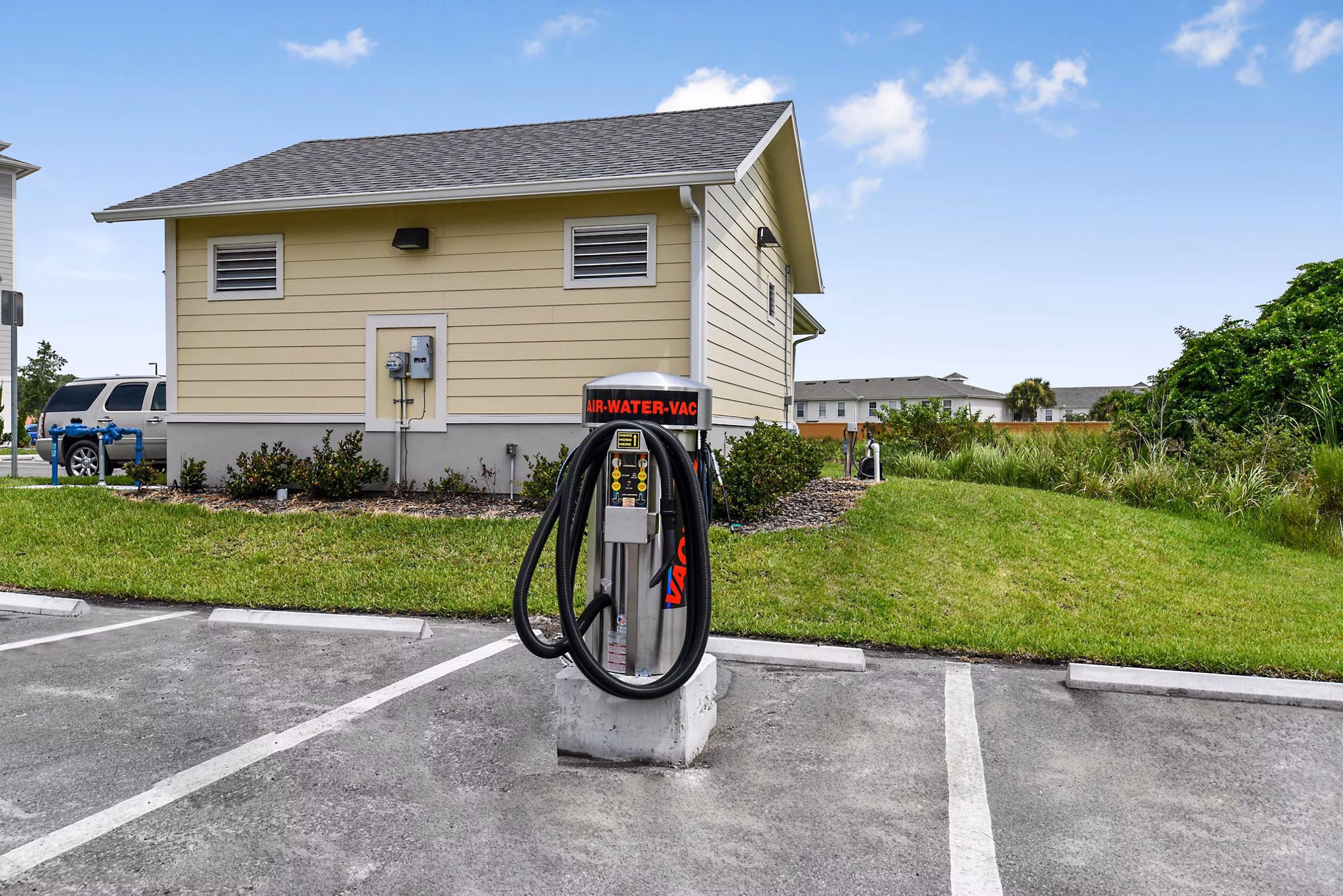Car care station at Isla Apartments with convenient amenities for residents