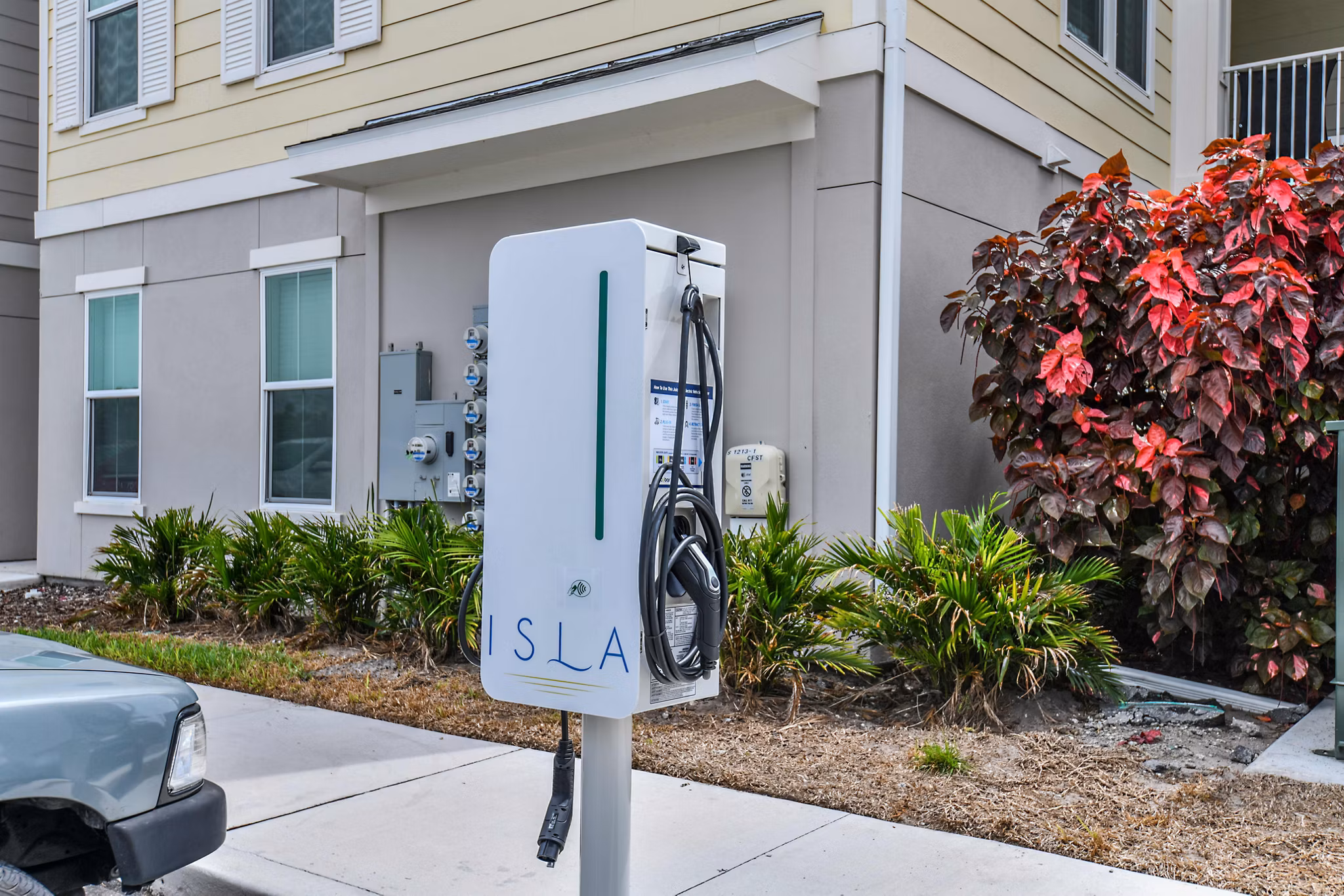 Electric car charging station at Isla Apartments, sustainable living in the heart of the city