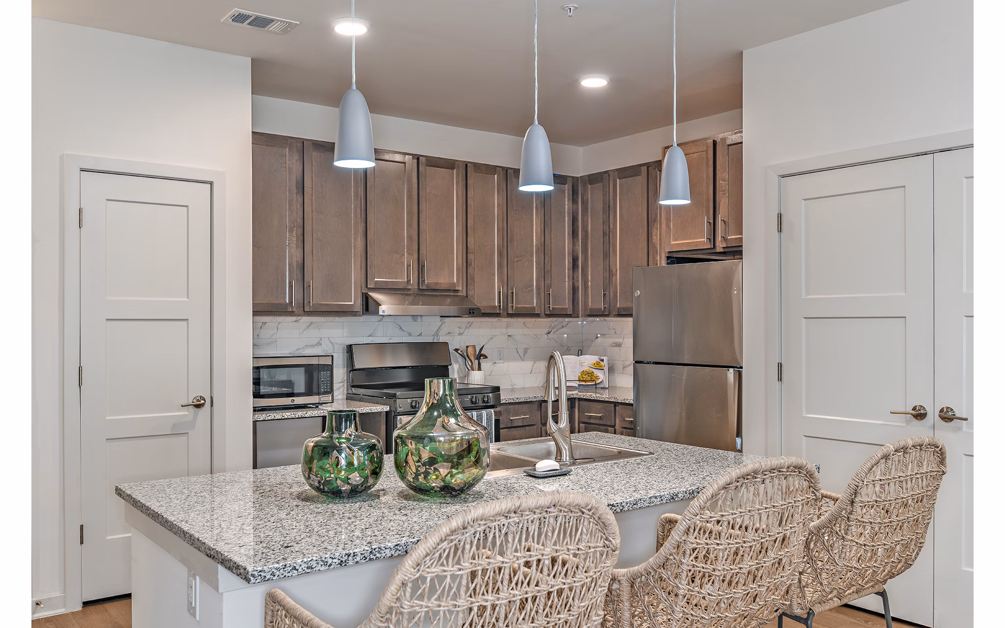 Modern kitchen with stainless steel appliances at Renaissance Santa Rosa Apartments