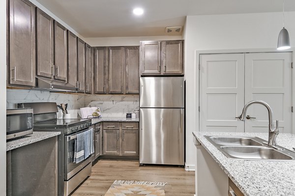 Modern kitchen with stainless steel appliances at Renaissance Santa Rosa Apartments