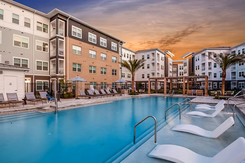Relaxing pool area with lounge chairs at Renaissance Santa Rosa Apartments