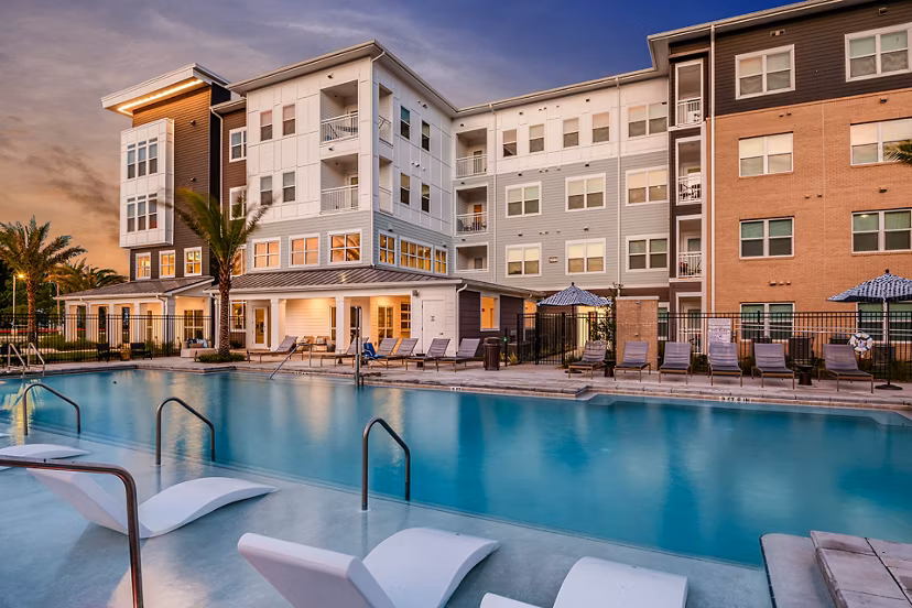 Resort-style pool surrounded by lush landscaping at Renaissance Santa Rosa Apartments, perfect for relaxation and leisure
