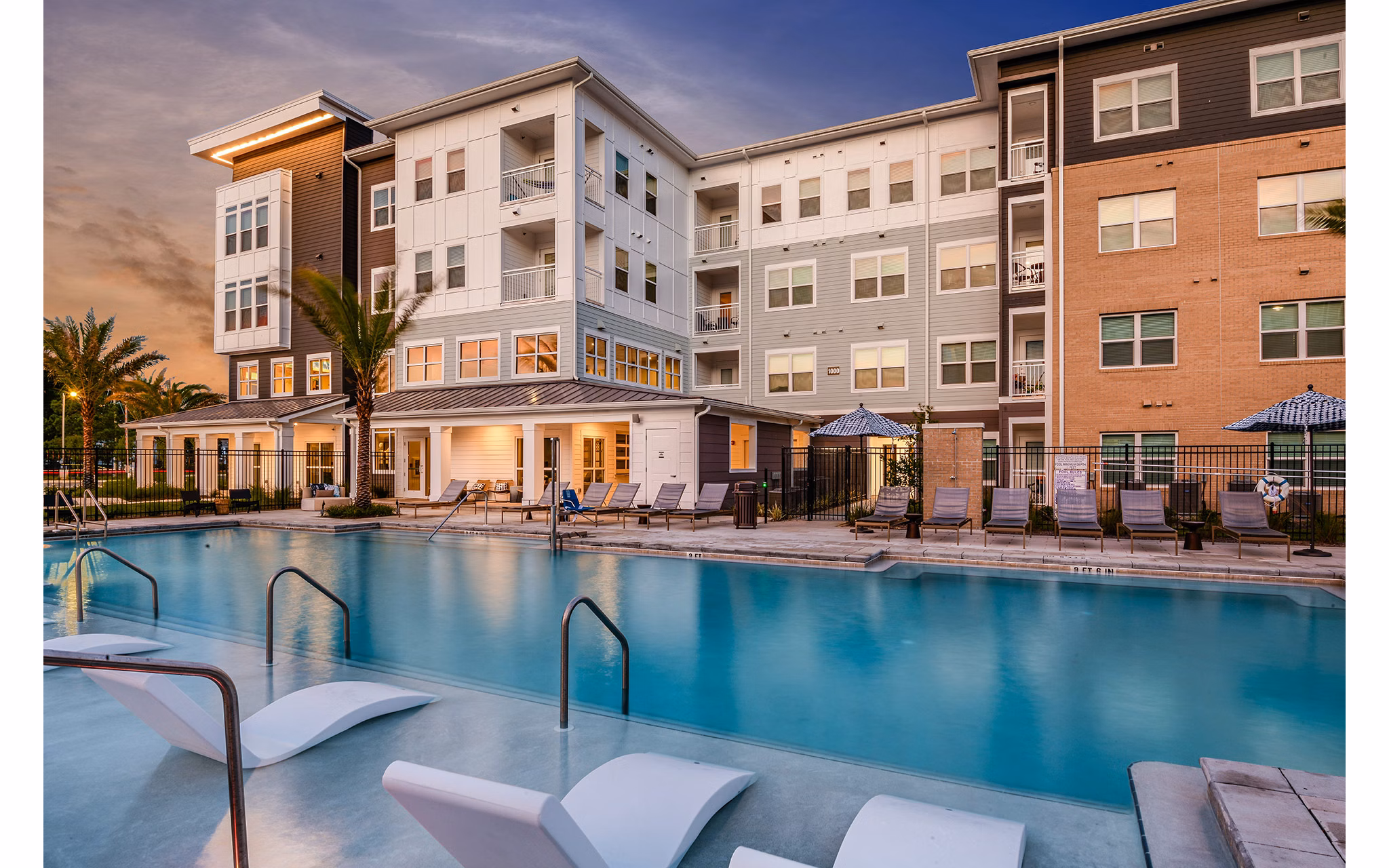 Resort-style pool surrounded by lush landscaping at Renaissance Santa Rosa Apartments, perfect for relaxation and leisure