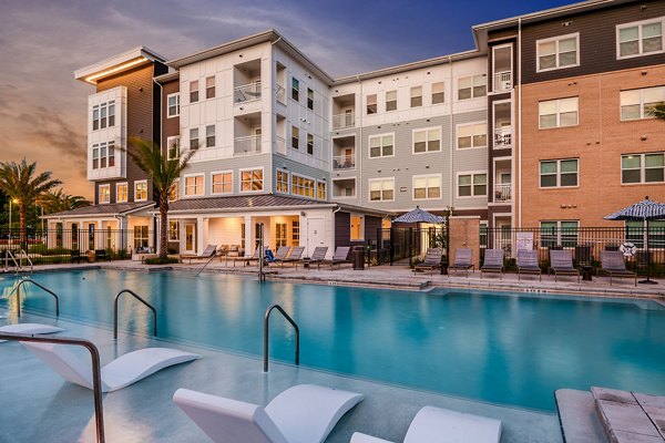 Resort-style pool surrounded by lush landscaping at Renaissance Santa Rosa Apartments, perfect for relaxation and leisure