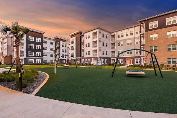 Playground with modern equipment at Renaissance Santa Rosa Apartments for family-friendly fun