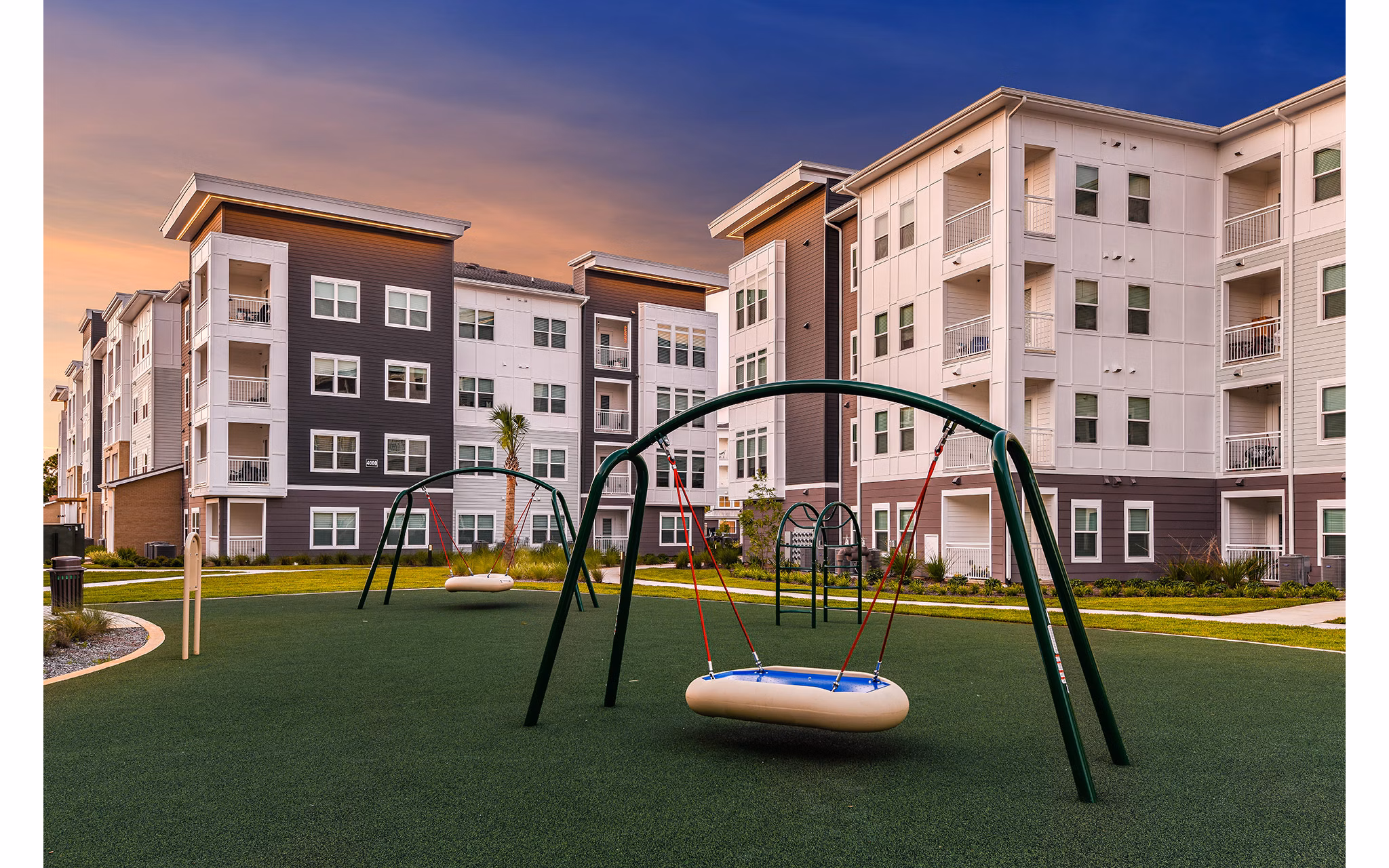 Modern playground at Renaissance Santa Rosa Apartments with colorful equipment and safe surfaces for luxury living