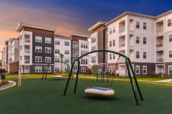 Modern playground at Renaissance Santa Rosa Apartments with colorful equipment and safe surfaces for luxury living